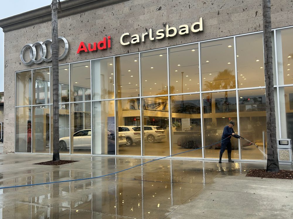 Audi Carlsbad showroom glass being cleaned