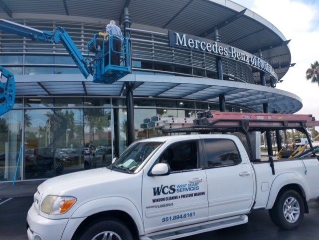 West Coast Services truck and lift at a Mercedes-Benz dealership